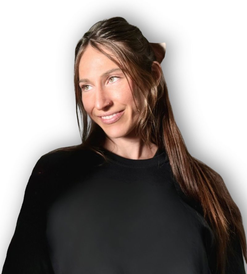 Kay Tapia, smiling, in a black sweatshirt